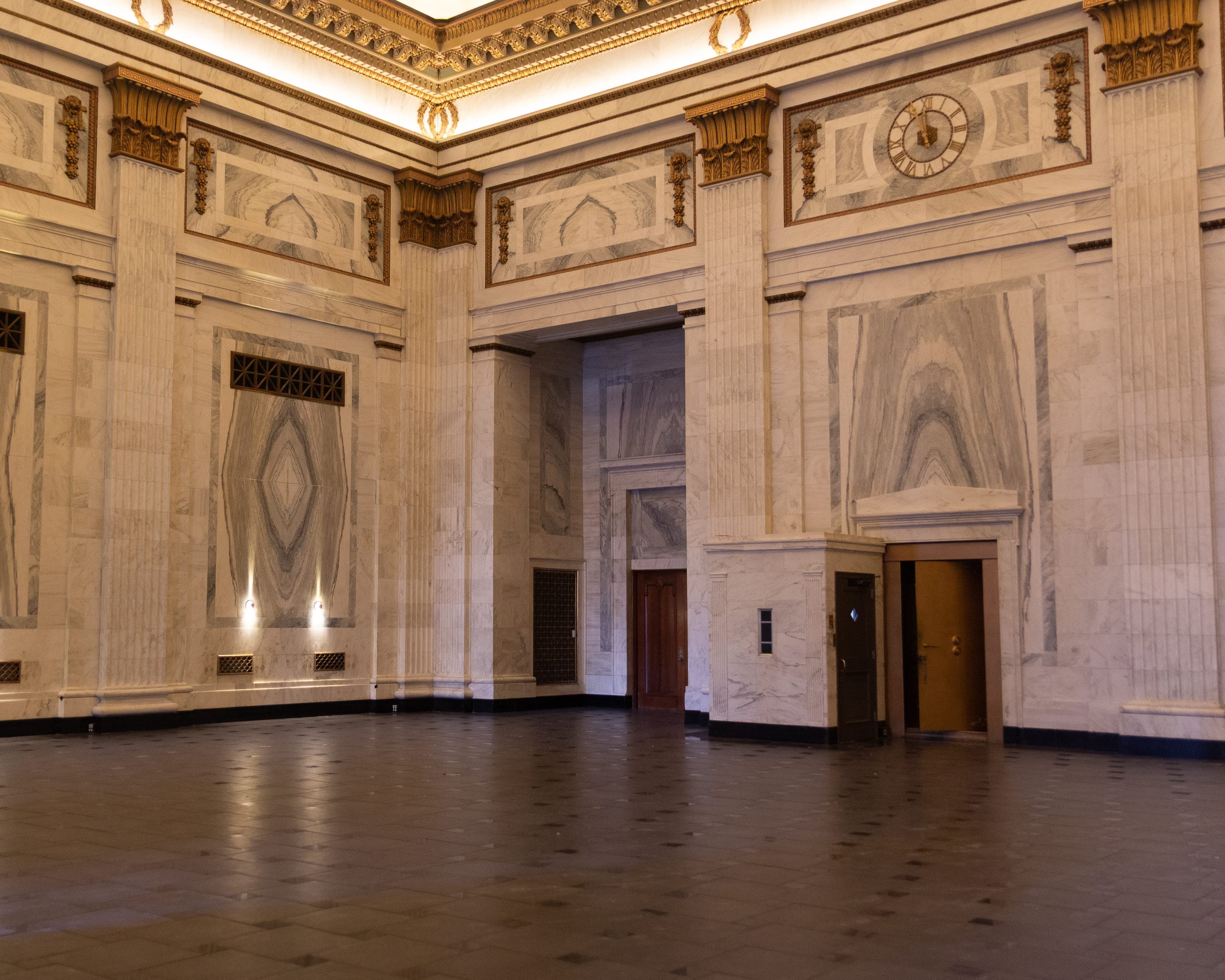 A spacious ballroom with marble walls