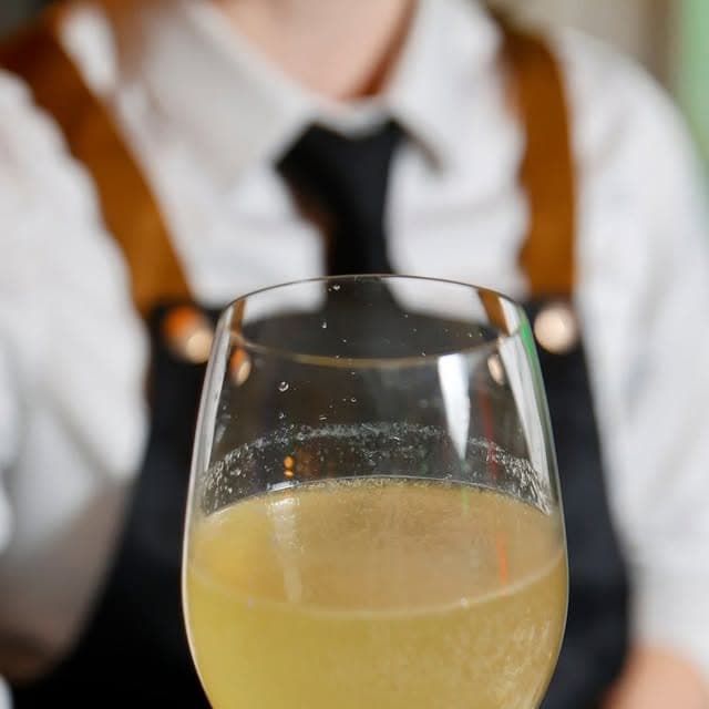 A celebratory cocktail raised in a toast to the new year